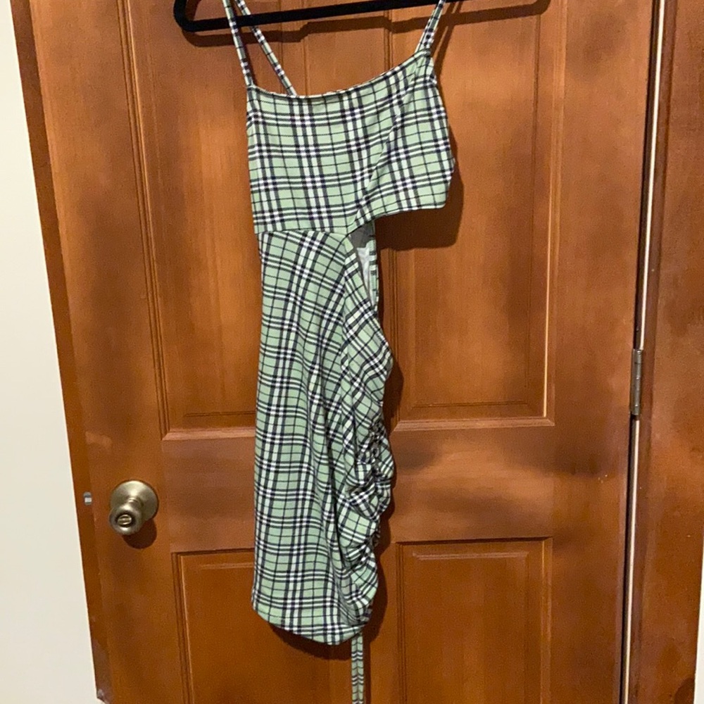 Green plaid cutout dress with ruffles on the side
